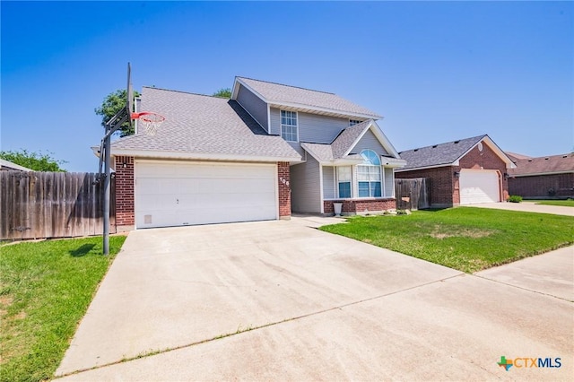 traditional-style house with concrete driveway, a front lawn, brick siding, a garage, and fence