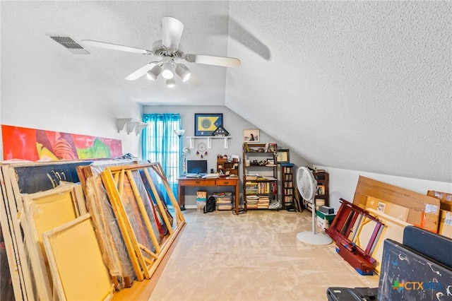 interior space with a textured ceiling, a ceiling fan, visible vents, carpet flooring, and lofted ceiling
