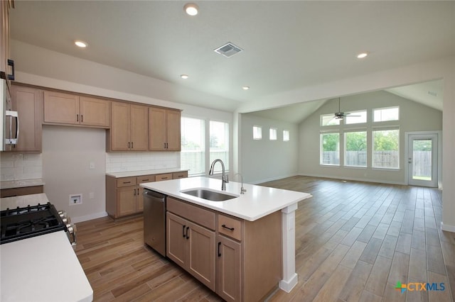 kitchen featuring dishwasher, a healthy amount of sunlight, a sink, and visible vents