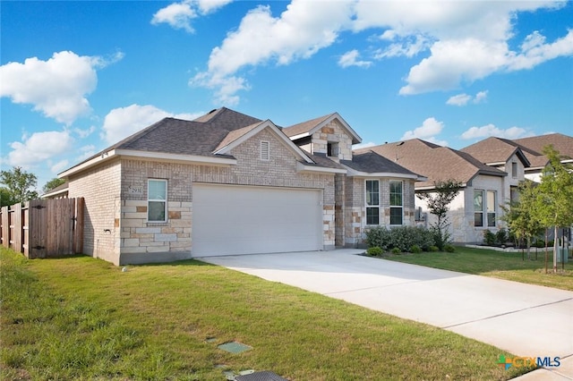 view of front of house with fence, concrete driveway, an attached garage, stone siding, and brick siding