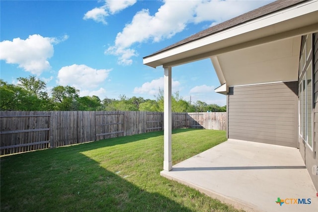view of yard with a patio area and a fenced backyard