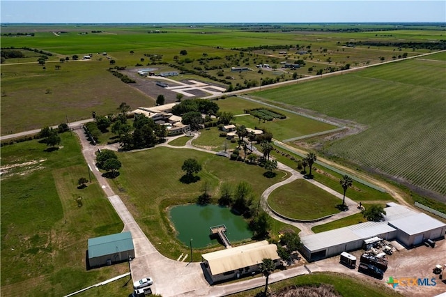 drone / aerial view with a water view and a rural view