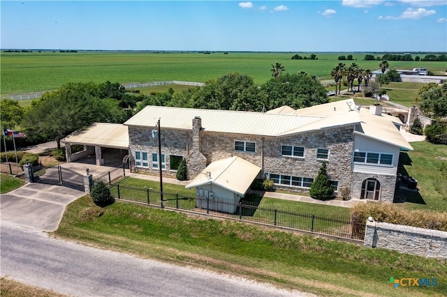 birds eye view of property with a rural view