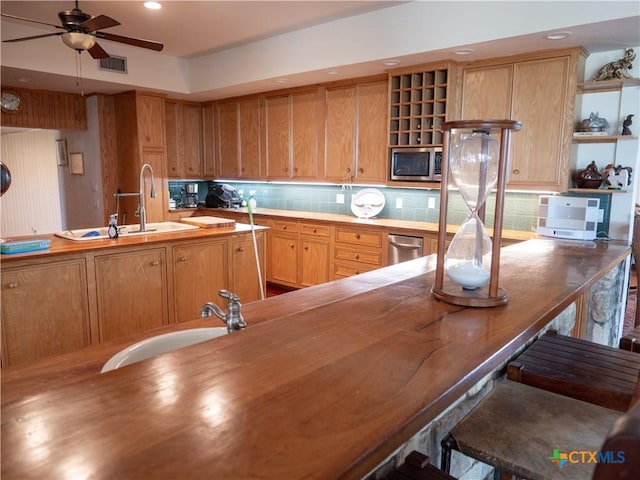 kitchen with tasteful backsplash, open shelves, a ceiling fan, visible vents, and stainless steel appliances
