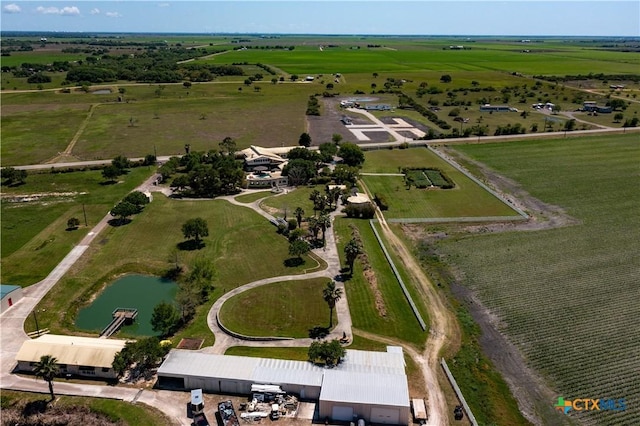 drone / aerial view featuring a rural view and a water view