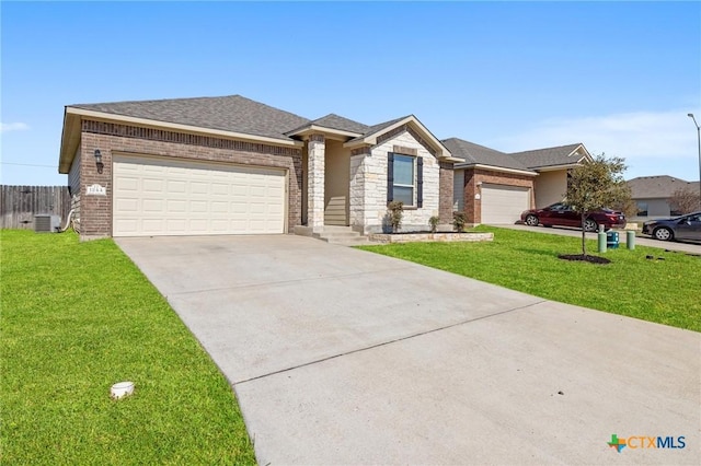 view of front of home featuring stone siding, concrete driveway, a front yard, a garage, and brick siding