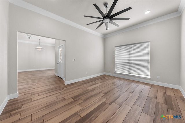 unfurnished room with ceiling fan with notable chandelier, light hardwood / wood-style floors, and ornamental molding