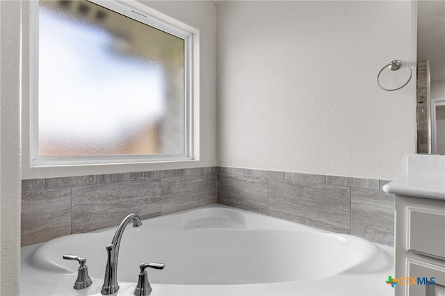 bathroom featuring vanity and a wealth of natural light