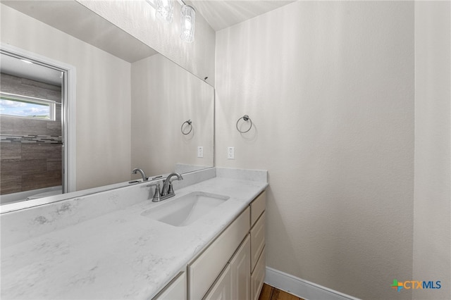 bathroom featuring hardwood / wood-style floors and vanity