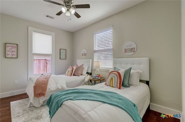 bedroom featuring ceiling fan and dark hardwood / wood-style flooring