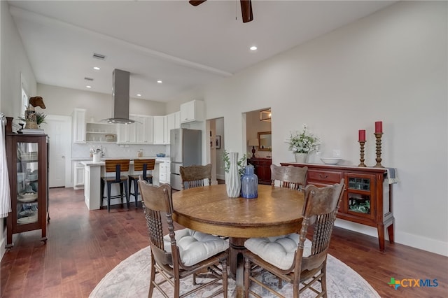 dining area featuring dark hardwood / wood-style flooring and ceiling fan