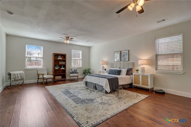 bedroom featuring dark wood-type flooring and ceiling fan