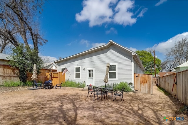 rear view of house featuring a patio