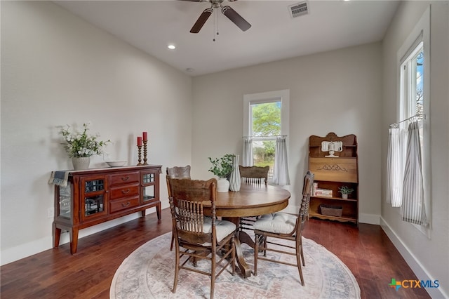 dining room with dark wood-type flooring and ceiling fan