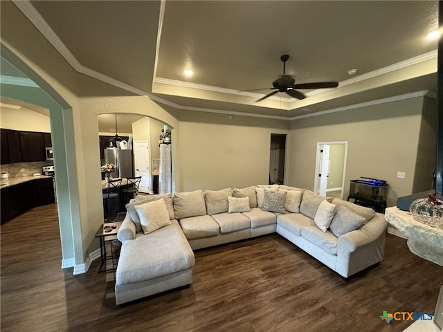 living room featuring dark hardwood / wood-style flooring and crown molding