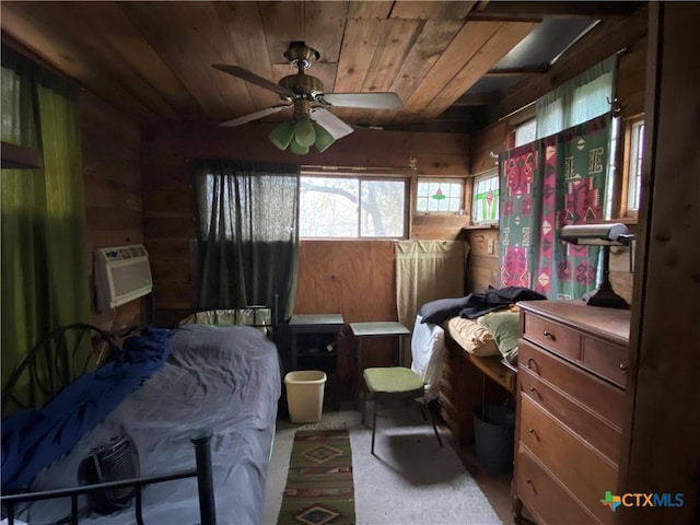 bedroom with a wall mounted air conditioner, wood ceiling, and wood walls