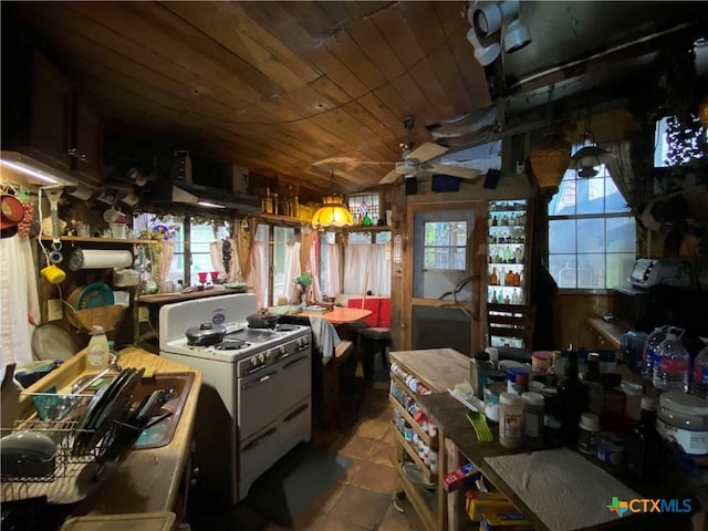kitchen featuring white cabinetry, lofted ceiling, light tile patterned floors, white stove, and wooden ceiling