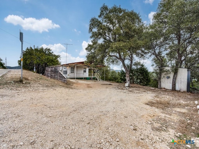 1400 Qappuella Dr, Canyon Lake, TX 78133 - view of yard with an outbuilding and stairs
