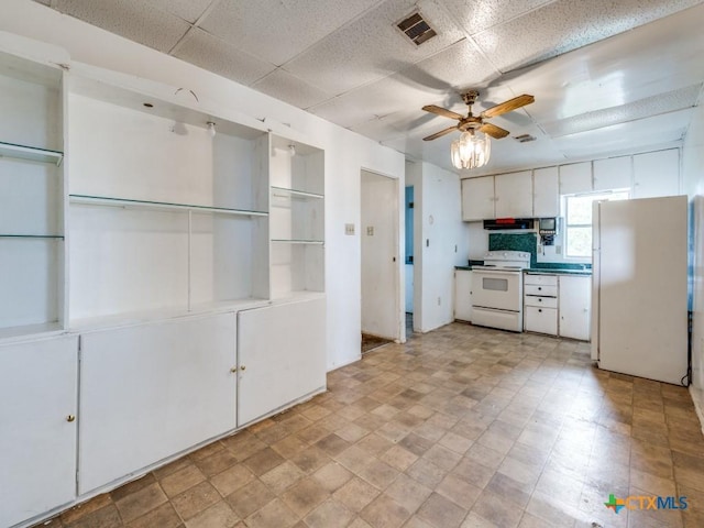 1400 Qappuella Dr, Canyon Lake, TX 78133 - kitchen featuring white cabinets, a paneled ceiling, visible vents, a ceiling fan, and white appliances