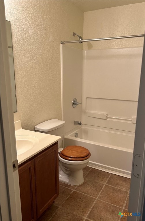 full bathroom with toilet, vanity, shower / bath combination, and tile patterned floors