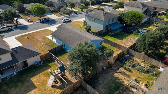 birds eye view of property with a residential view