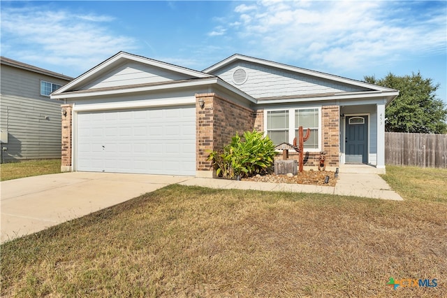 single story home featuring a front lawn and a garage