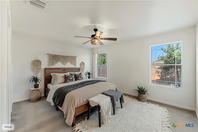 bedroom with ceiling fan, visible vents, and baseboards