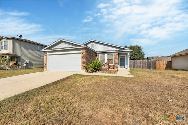 view of front of house with brick siding, concrete driveway, an attached garage, a front yard, and fence