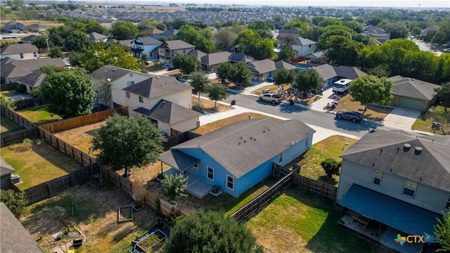 birds eye view of property with a residential view