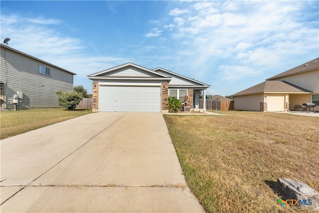 view of front of property with a garage and a front lawn