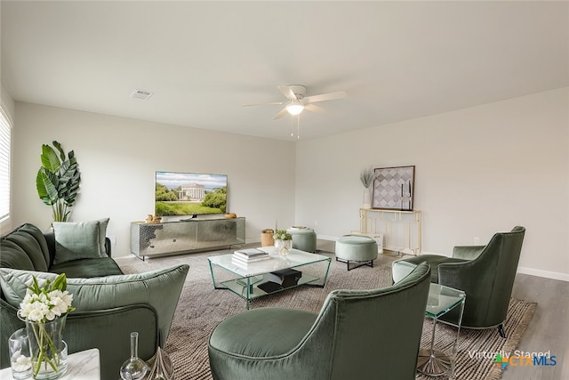 living room with hardwood / wood-style floors and ceiling fan