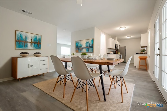 dining area featuring wood-type flooring