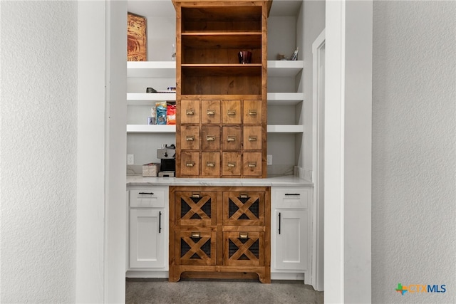 bar featuring white cabinets