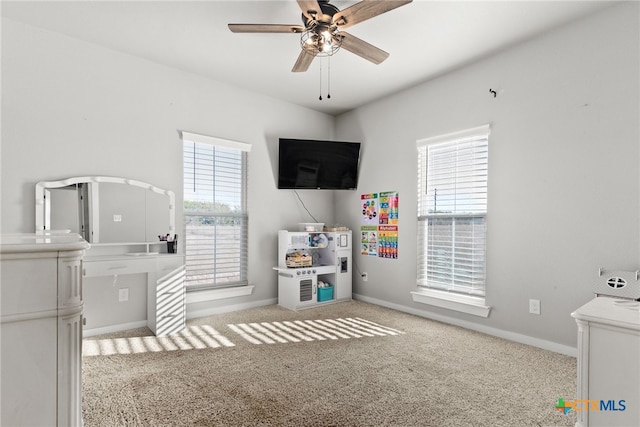 playroom featuring ceiling fan and light colored carpet