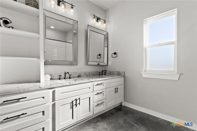 bathroom featuring walk in shower, vanity, and concrete floors