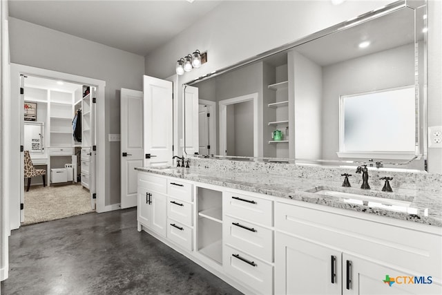 bathroom featuring vanity and concrete floors