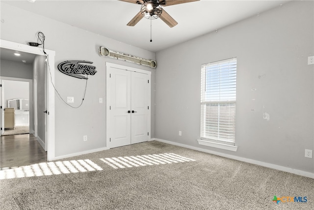 unfurnished bedroom with carpet floors and a closet