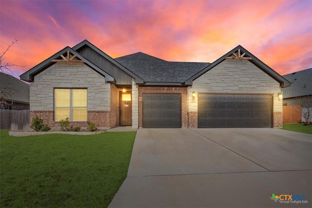 7516 Hardin Dr, Temple, TX 76502 - view of front of house with an attached garage, driveway, board and batten siding, brick siding, and stone siding