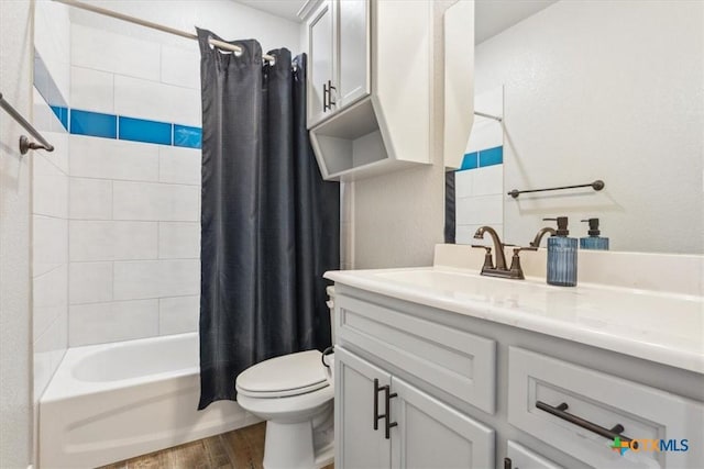 7516 Hardin Dr, Temple, TX 76502 - full bath featuring wood finished floors, vanity, toilet, and shower / tub combo