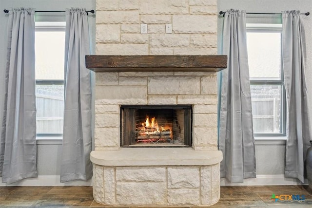 7516 Hardin Dr, Temple, TX 76502 - detailed view of baseboards, wood finished floors, and a fireplace