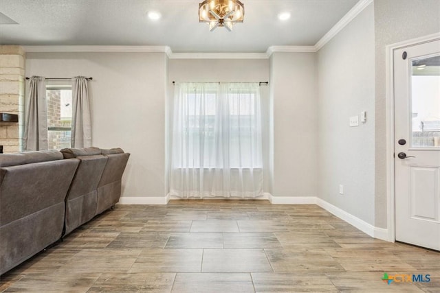 7516 Hardin Dr, Temple, TX 76502 - living room featuring crown molding, baseboards, and recessed lighting