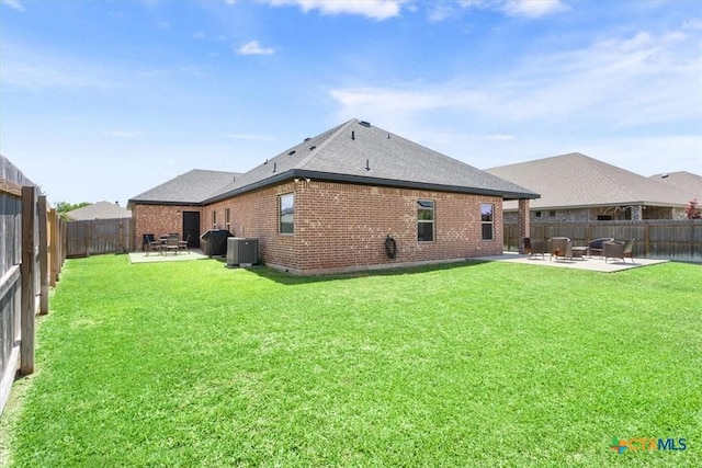 7516 Hardin Dr, Temple, TX 76502 - rear view of property featuring a patio area, cooling unit, brick siding, and roof with shingles