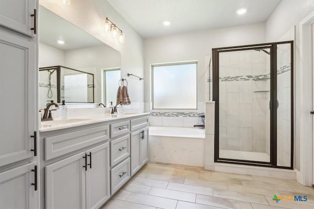 7516 Hardin Dr, Temple, TX 76502 - bathroom with a garden tub, a stall shower, double vanity, and recessed lighting