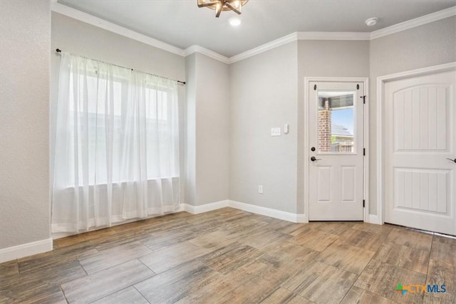 7516 Hardin Dr, Temple, TX 76502 - foyer with plenty of natural light, crown molding, wood finished floors, and baseboards