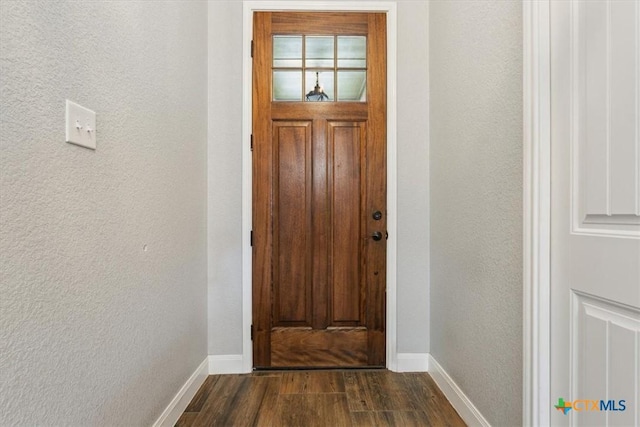 7516 Hardin Dr, Temple, TX 76502 - entryway featuring a textured wall, dark wood-type flooring, and baseboards