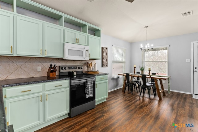 kitchen with dark wood-type flooring, stainless steel range with electric cooktop, decorative light fixtures, green cabinetry, and a notable chandelier