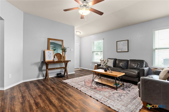 living room with ceiling fan, plenty of natural light, and dark hardwood / wood-style floors