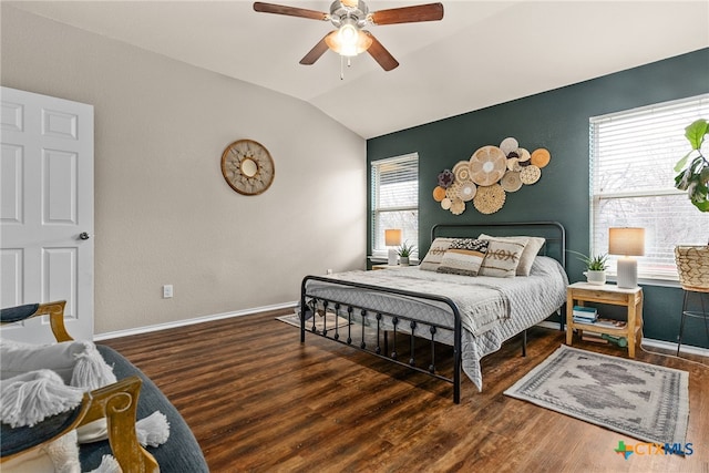 bedroom featuring dark hardwood / wood-style floors, ceiling fan, and lofted ceiling