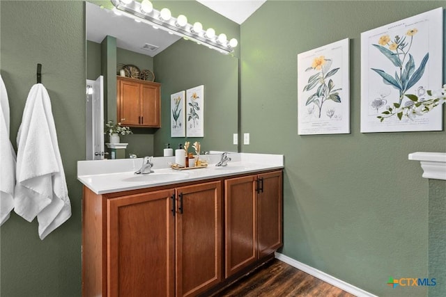 bathroom featuring vanity and hardwood / wood-style flooring