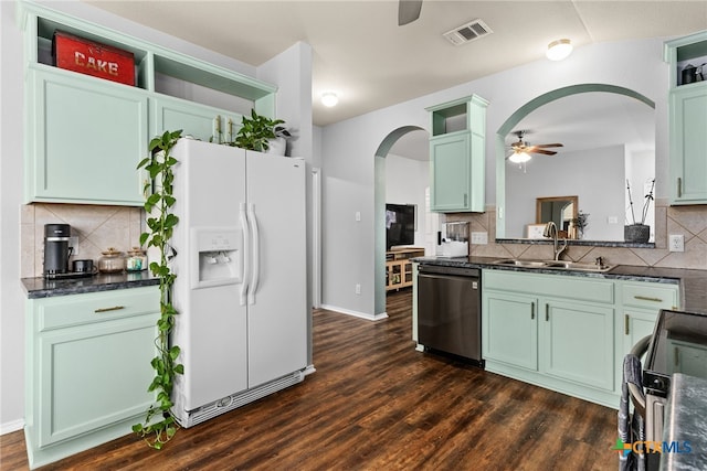 kitchen featuring stove, white refrigerator with ice dispenser, sink, stainless steel dishwasher, and ceiling fan